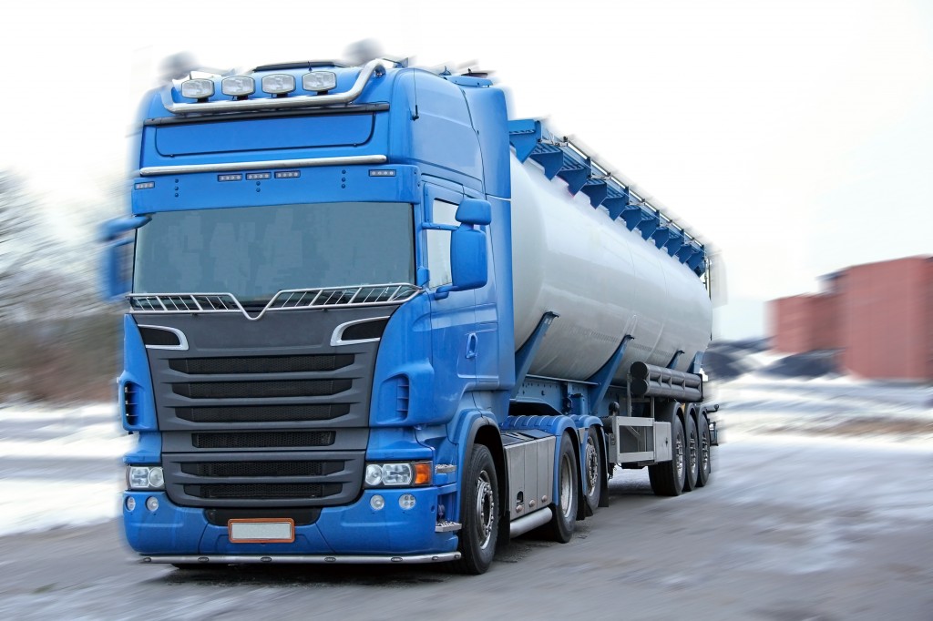 bigstock-Blue-Tanker-Truck-with-Motion--40840615